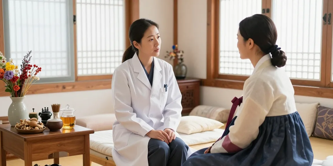 Consultation scene in 수원한의원, showing compassionate practitioner and patient discussing health in a calming environment